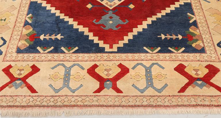 A semi-antique Anatolian Kars carpet, c. 302 x 236 cm.