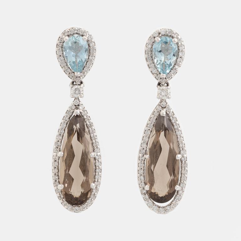 Aquamarine and smoky quartz and brilliant cut diamond earrings.