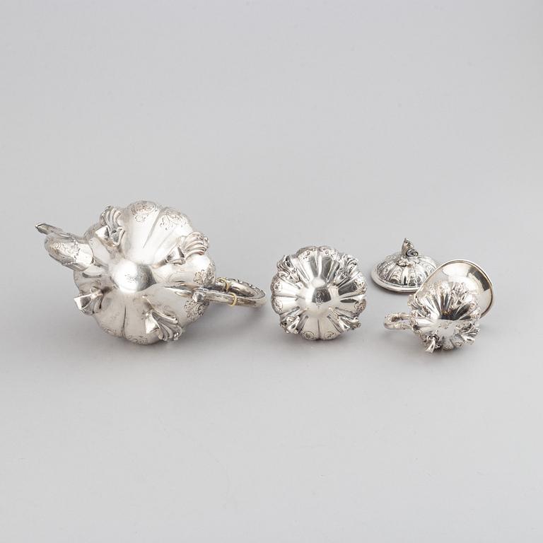 A silver teapot, creamer and sugar bowl, swedish import mark.