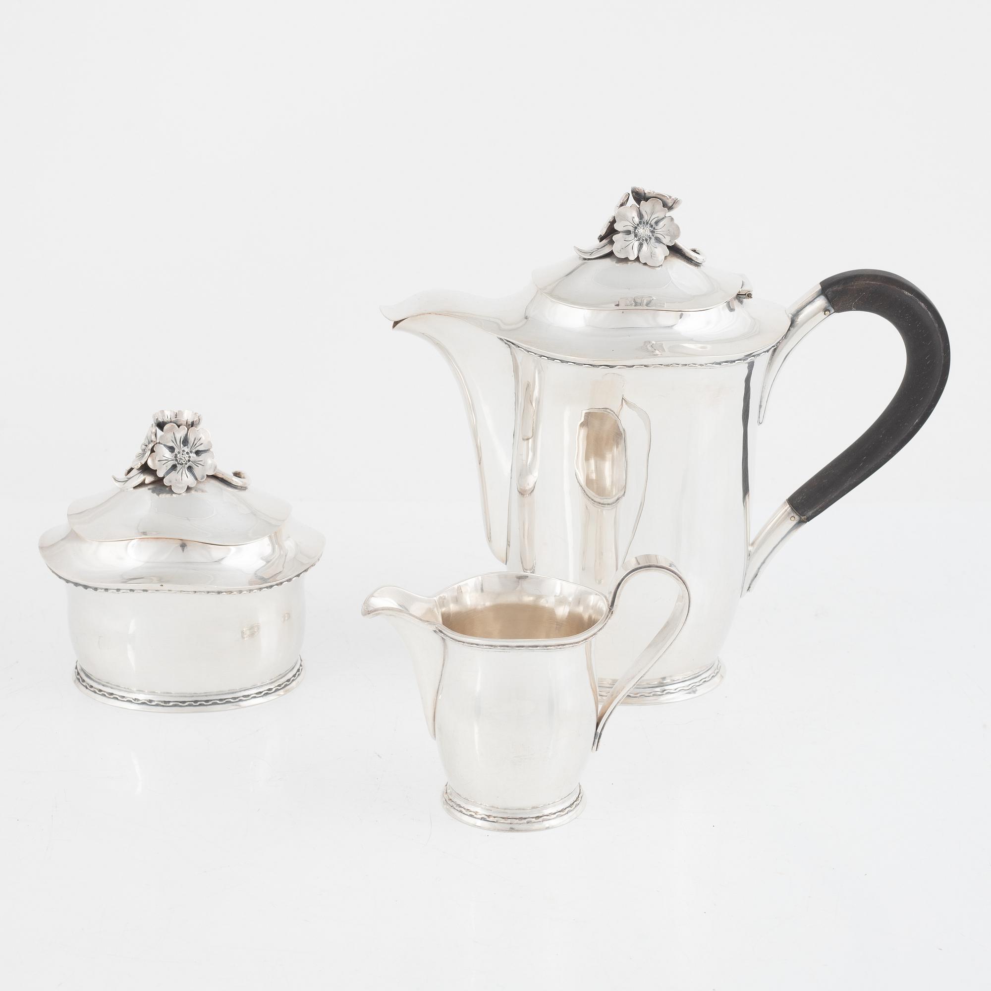 A Swedish Silver Coffee Pot, Creamer and Sugar Bowl, mark of Carl Fredrik Carlman, Stockholm 1951-54.