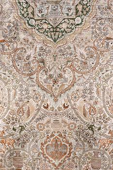 An oval pictoral silk carpet, ca 273 x 180 cm.