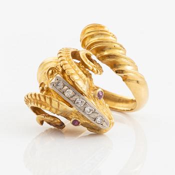 An 18K gold ram´s head ring set with round brilliant-cut diamonds and rubies.