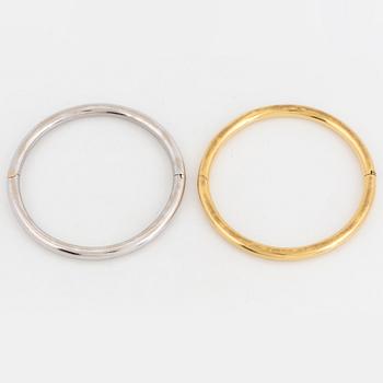 Two 18K gold and white gold bangles.