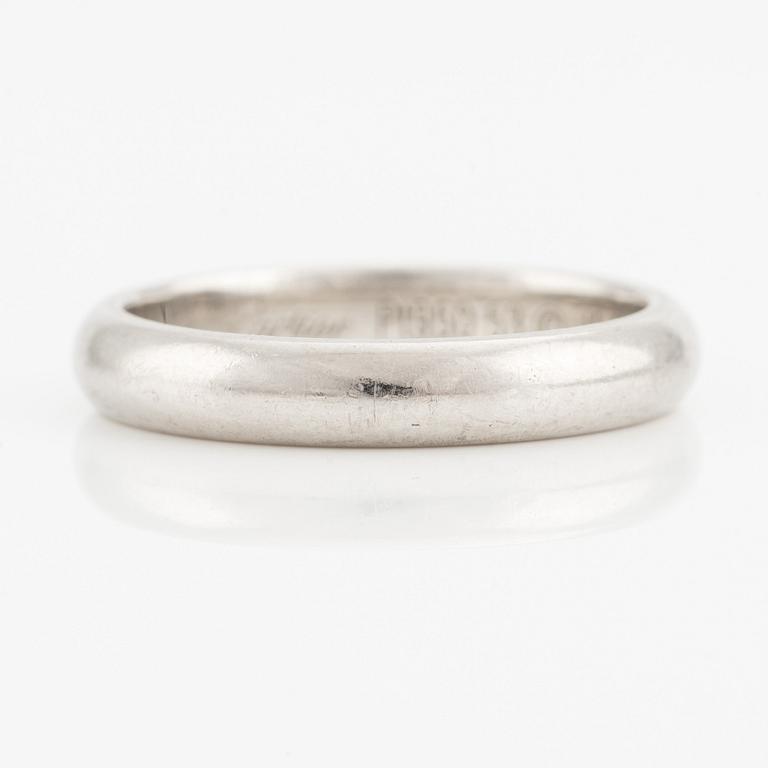 A Cartier platinum ring.