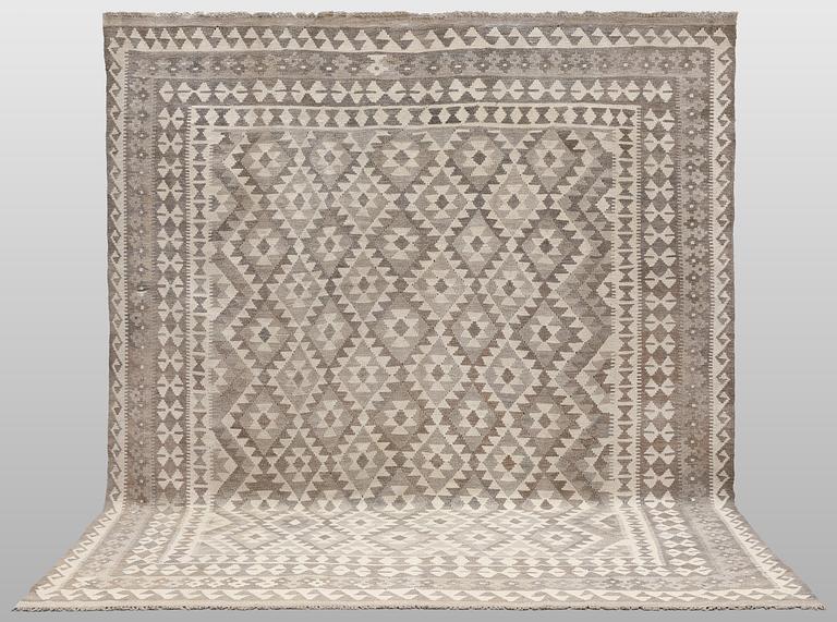 A Kilim rug, approx. 294 x 250 cm.