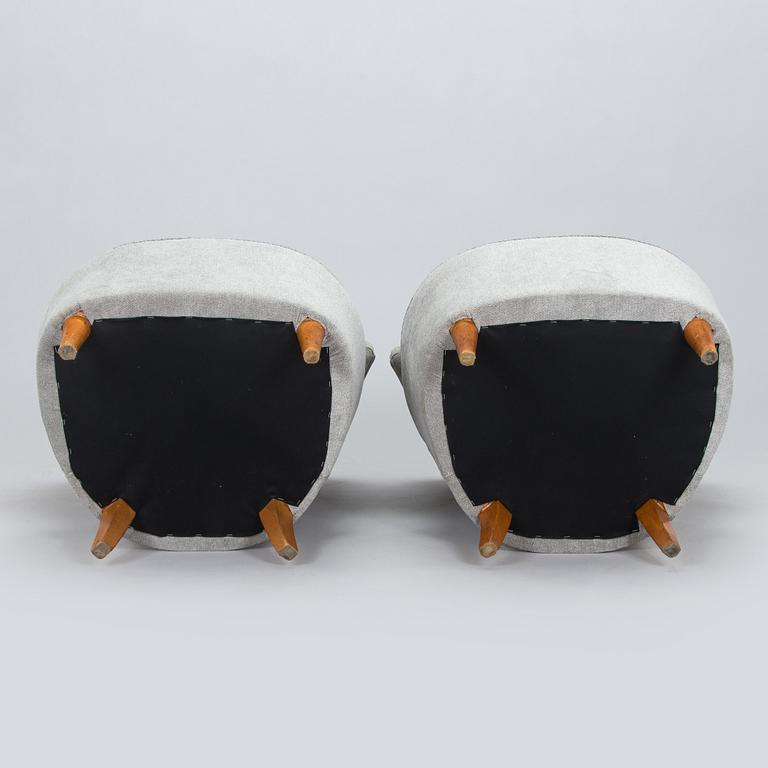 A pair of mid 20th century armchairs.