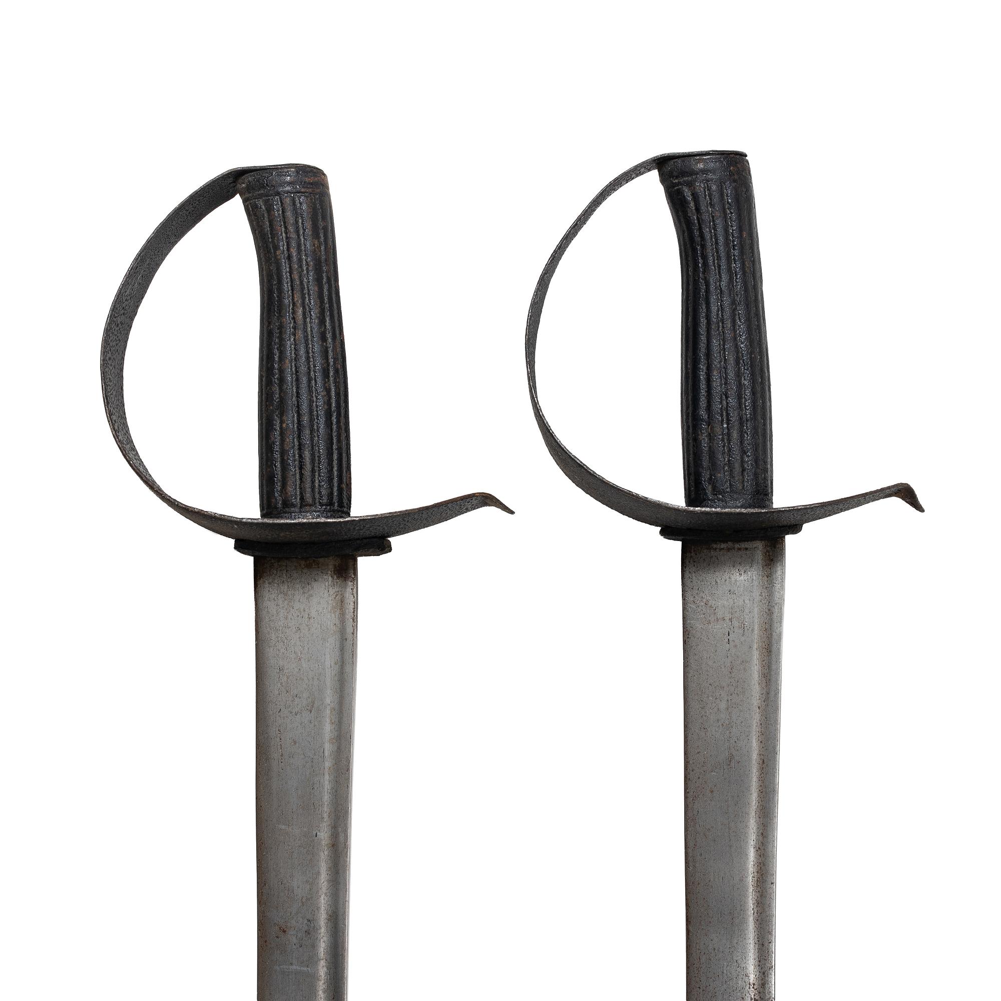 Two 19th century naval cutlasses.