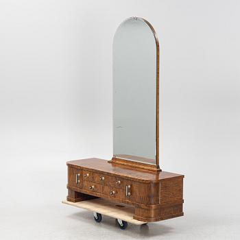A chest of drawers with mirror, 1930's.