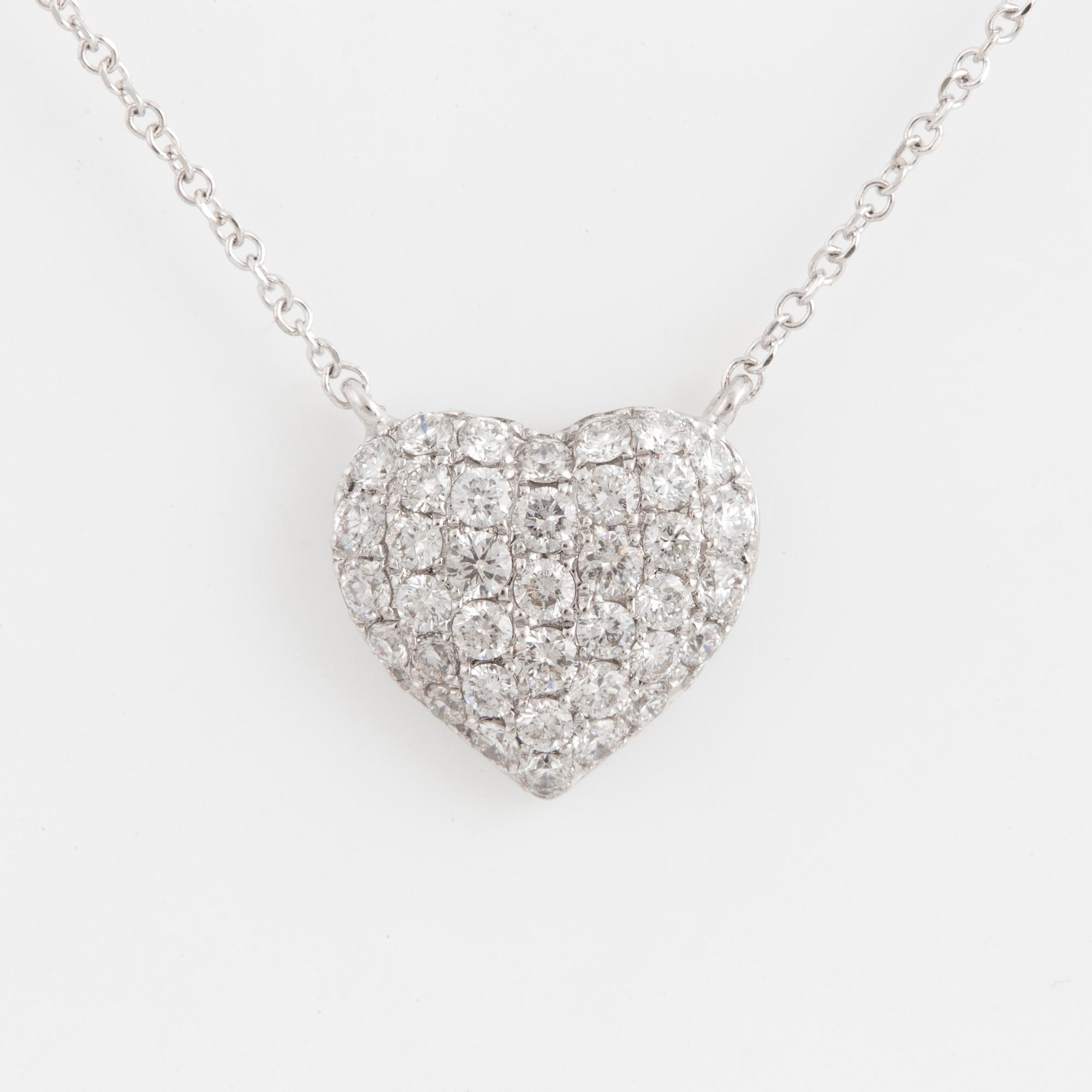A heart shaped brilliant-cut diamond necklace.