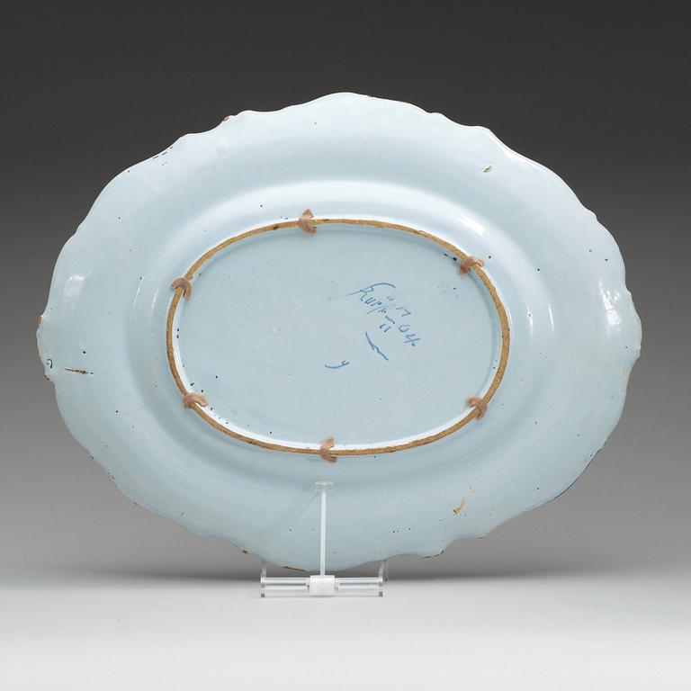 A Swedish Rörstrand faience charger, dated 17/11 (17)64.