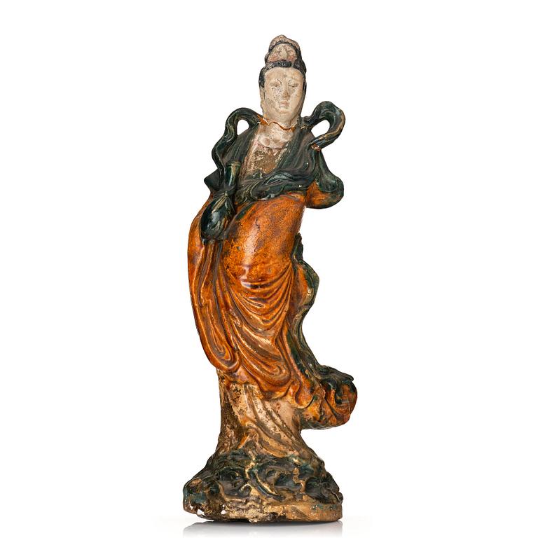 A green and yellow glazed Guanyin figure, late Ming dynasty/Qingdynasty.