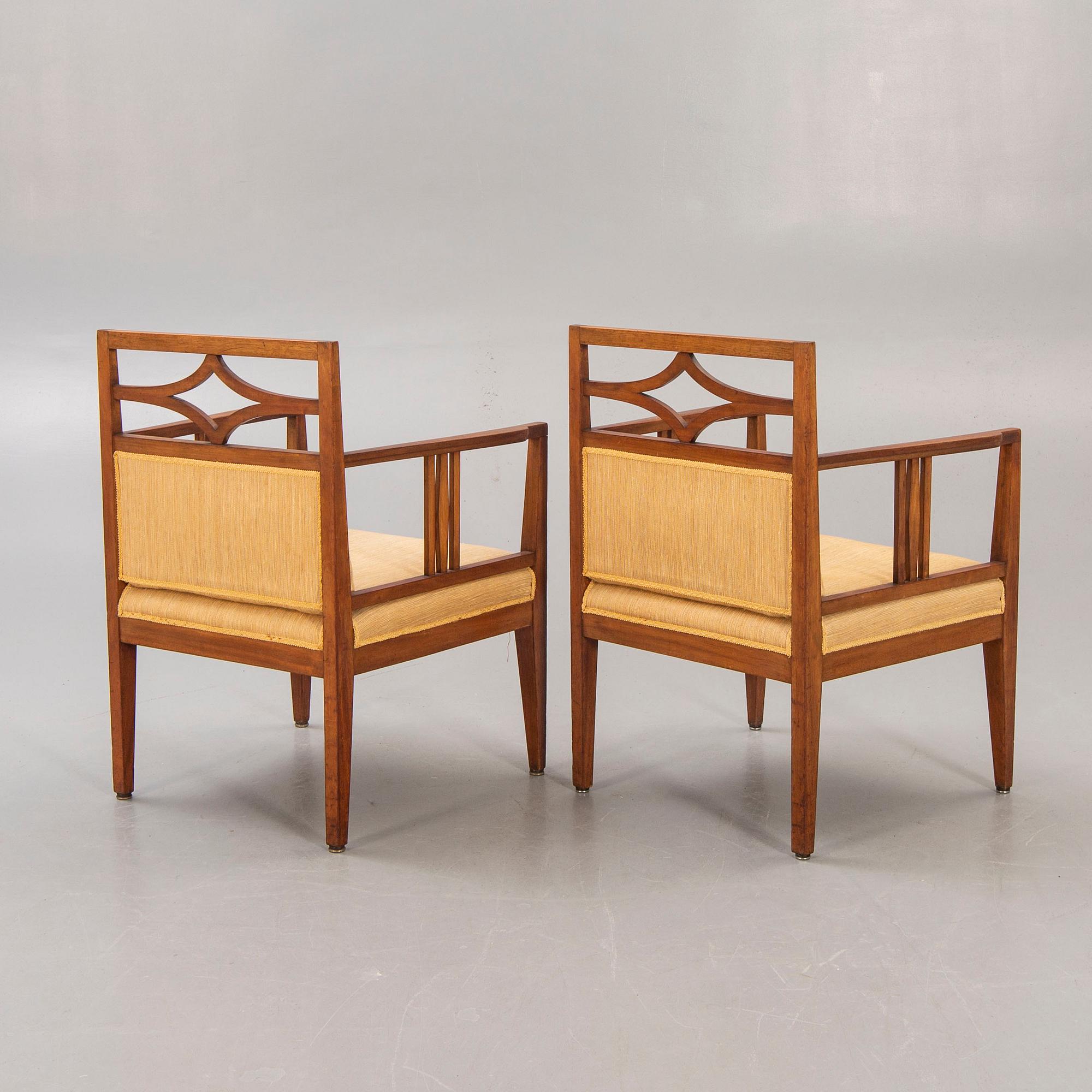 A pair of armchairs around 1900.