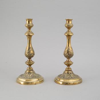 A pair of 18th century bronze candlesticks.