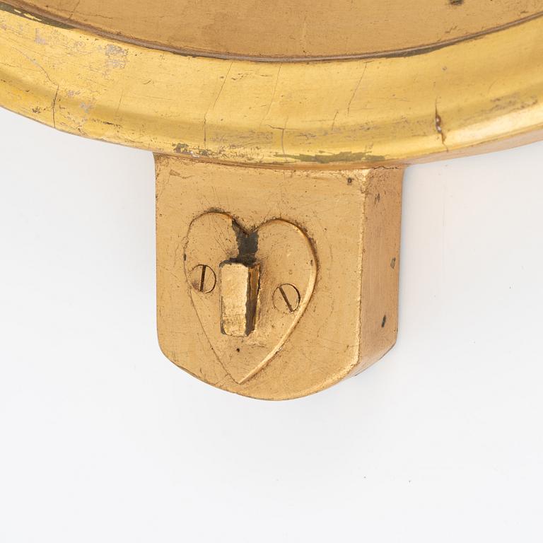 An Empire giltwood mirrored wall sconce by J. M. Berg (active in Gothenburg 1803- ca 1837).
