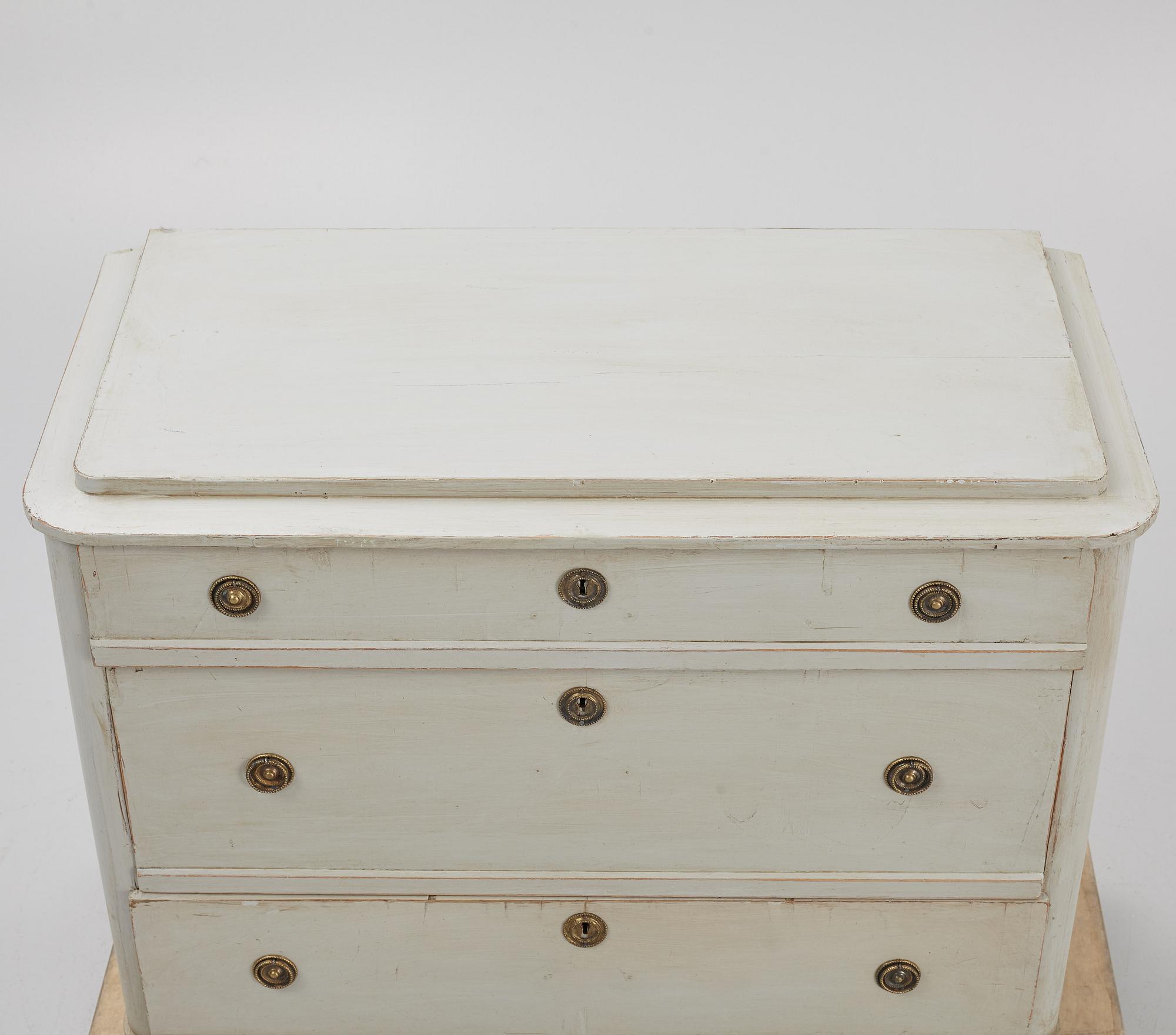 A chest of drawers, circa 1900.