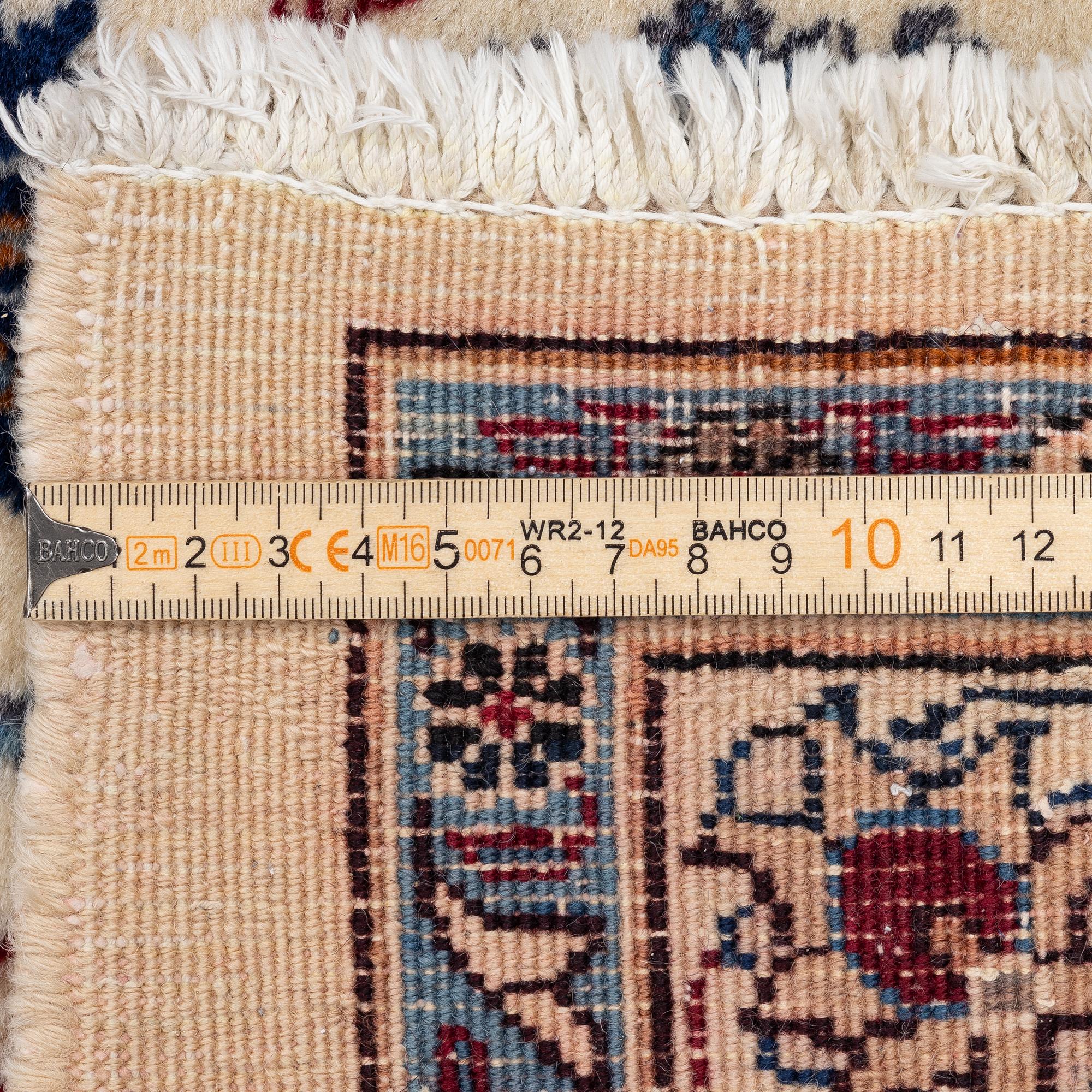 A Tabriz carpet, a. 373 x 286 cm.