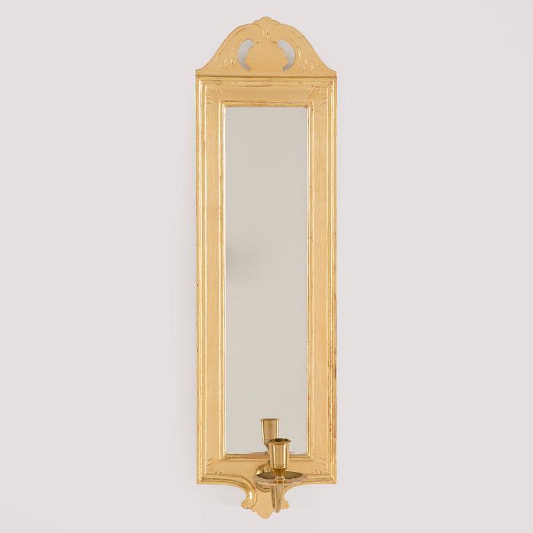 A 'Regnaholm' mirror wall sconse from IKEA. Originalbox included.