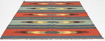 A kilim rug, c 242 x 181 cm.