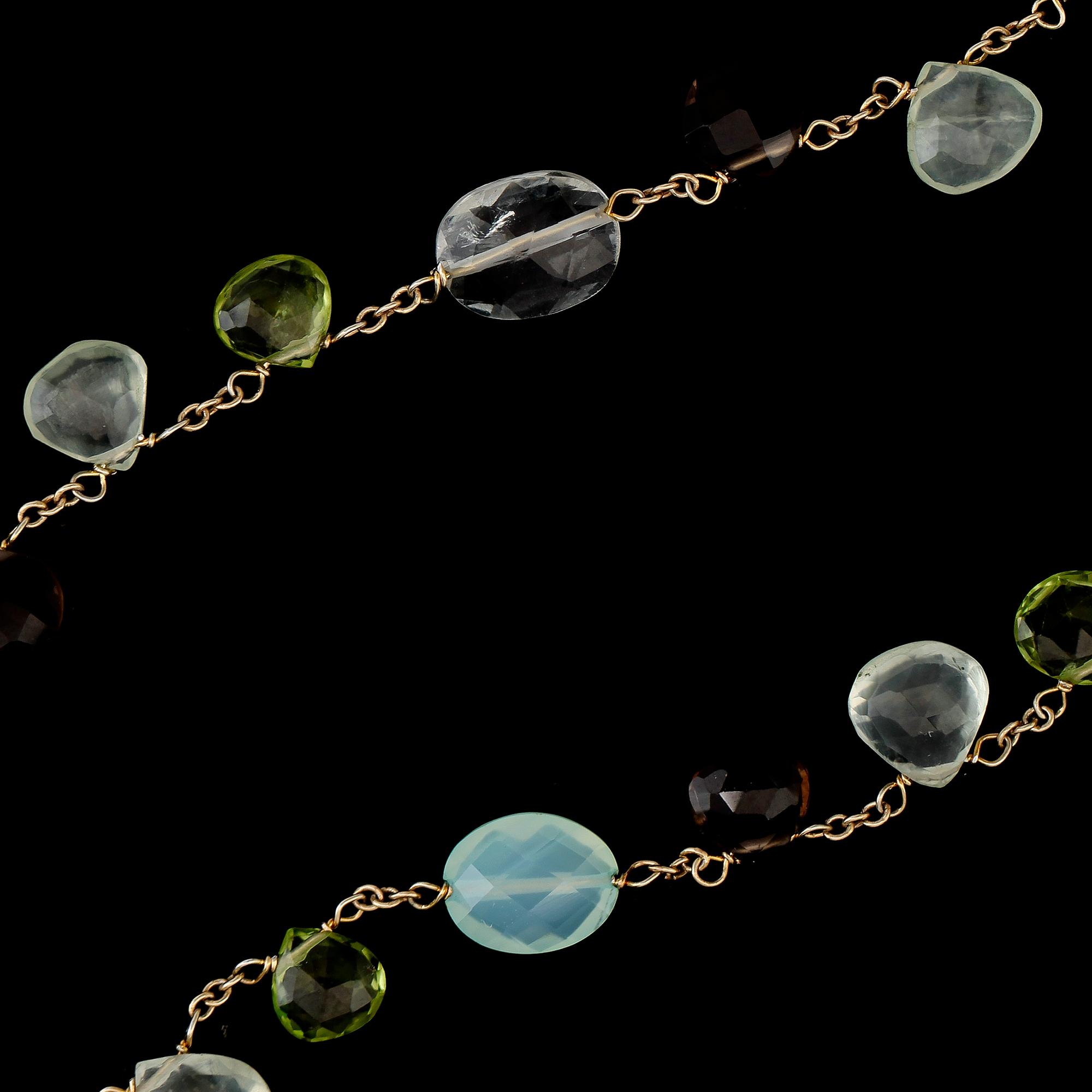 COLLIER, 14K guld och förgyllt silver, röktopaser och peridoter.