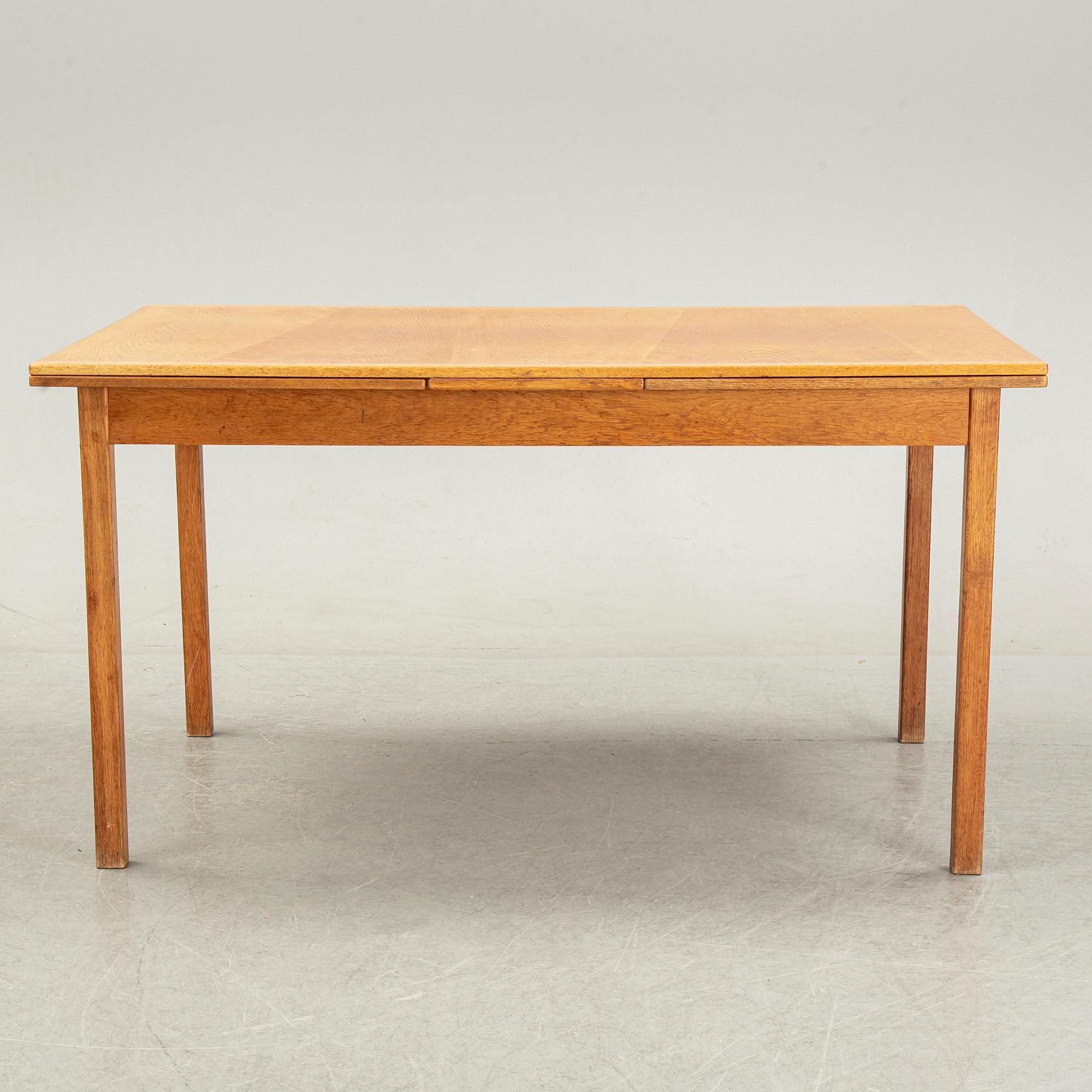 Knud Andersen, a set of six chairs for J.C.A Andersen, Aarhus, Denmark and a dinner table from Troeds, Bjärnum.