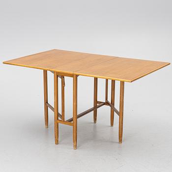 A mid20th century gate-leg table.