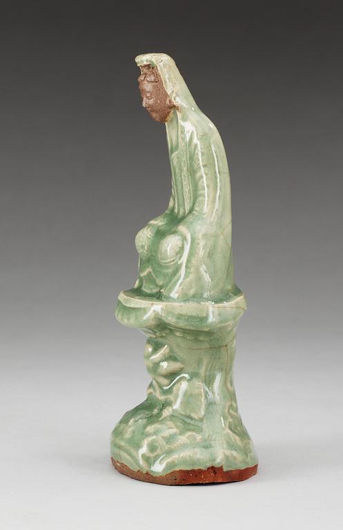 A celadon glazed figure of Guanyin, Ming dynasty.