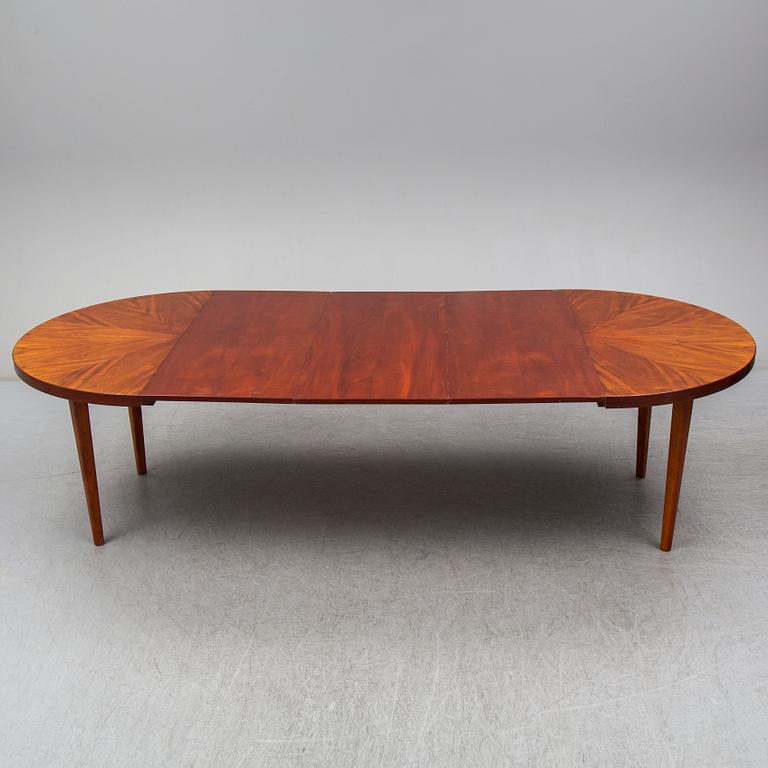 a mahogany dining table from the mid 20th century.