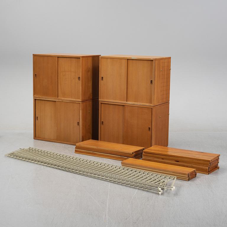 A 'String' teak veneered shelving system by Nils Strinning.