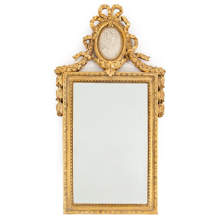 A bronzed gustavian style mirror from the second half of the 20th century.