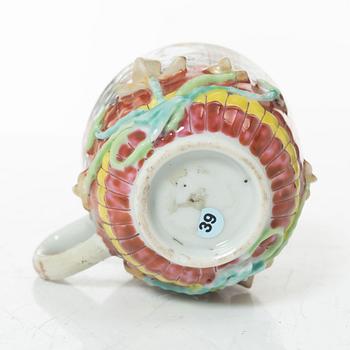 A small Chinese famille rose porcelain tureen with cover and stand, two salt cellars, Qing dynasty, Qianlong (1736-95).