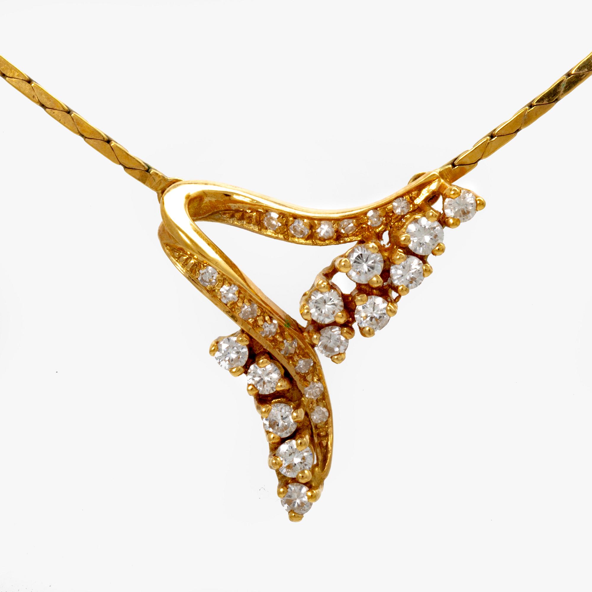 An 18K gold necklace with round brilliant cut diamonds.