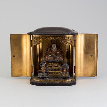 A Japanese wooden lacquered altar piece, with buddha and two deites, early 20th century.