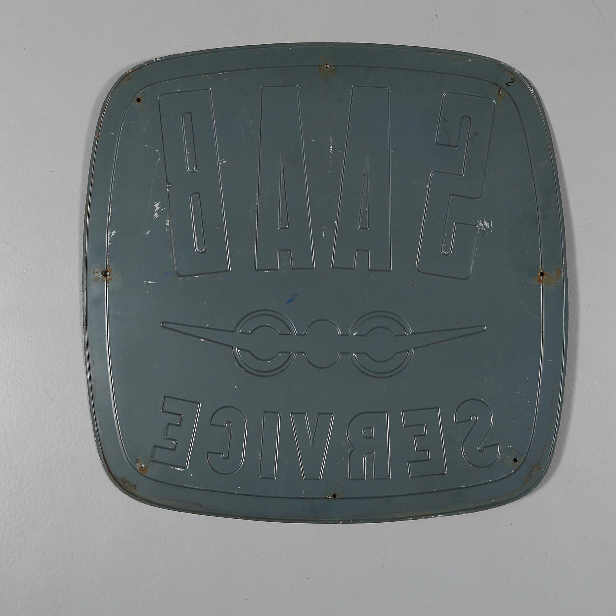 REKLAMSKYLT, metall, 1900-talets andra hälft.