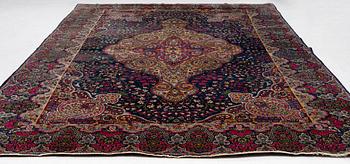A semi-antique Kirman carpet, south Persia, c. 440 x 279 cm.