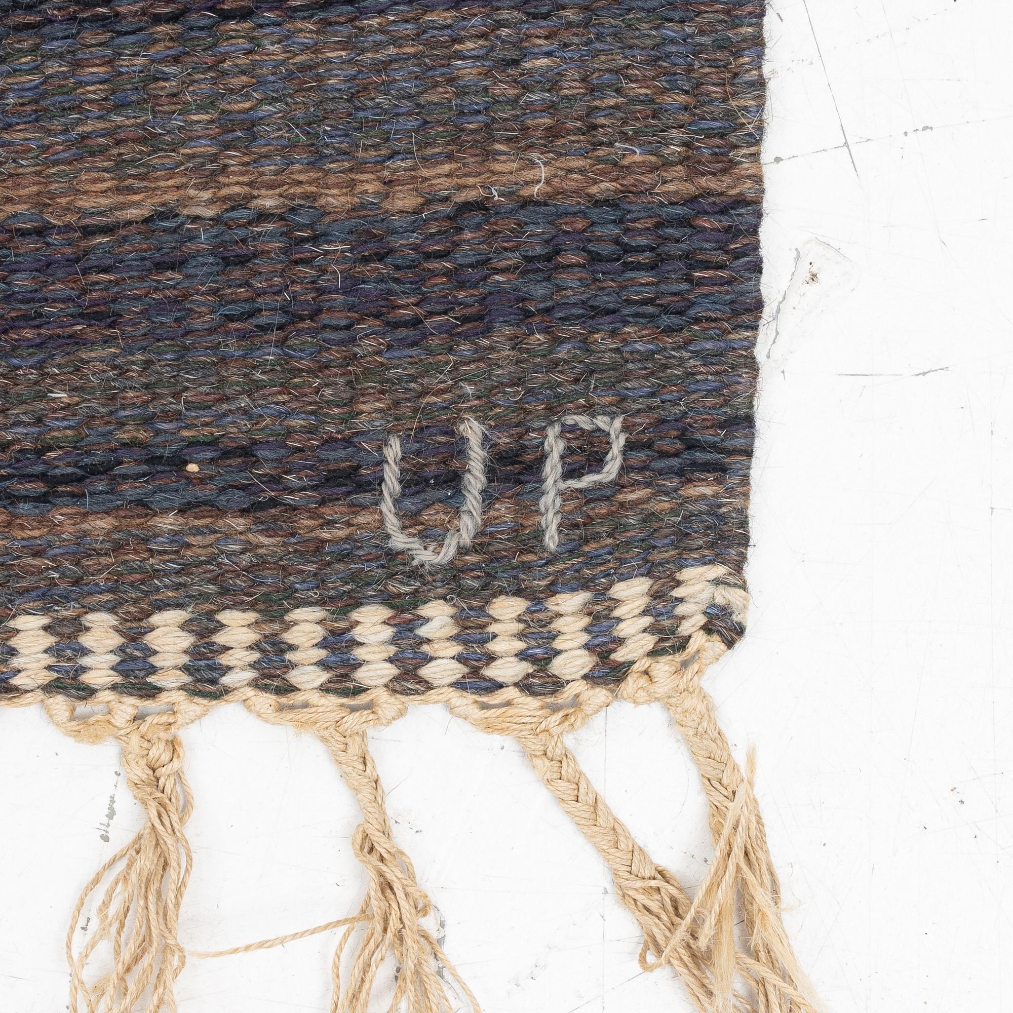 Ulla Parkdal, a flat weave carpat, c.. 304 x 196 cm, signed UP.