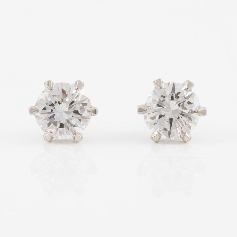 Brilliant-cut diamond stud earrings.