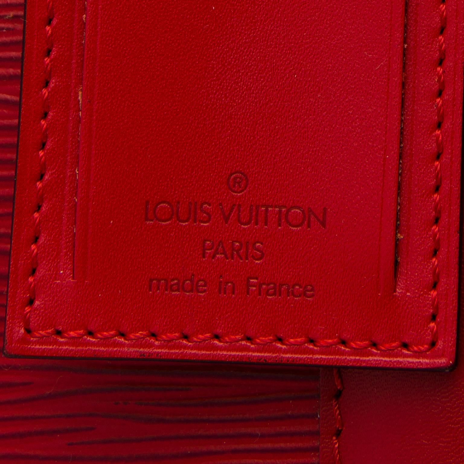 A RED EPI LEATHER KEEPALL 50 TRAVEL BAG.