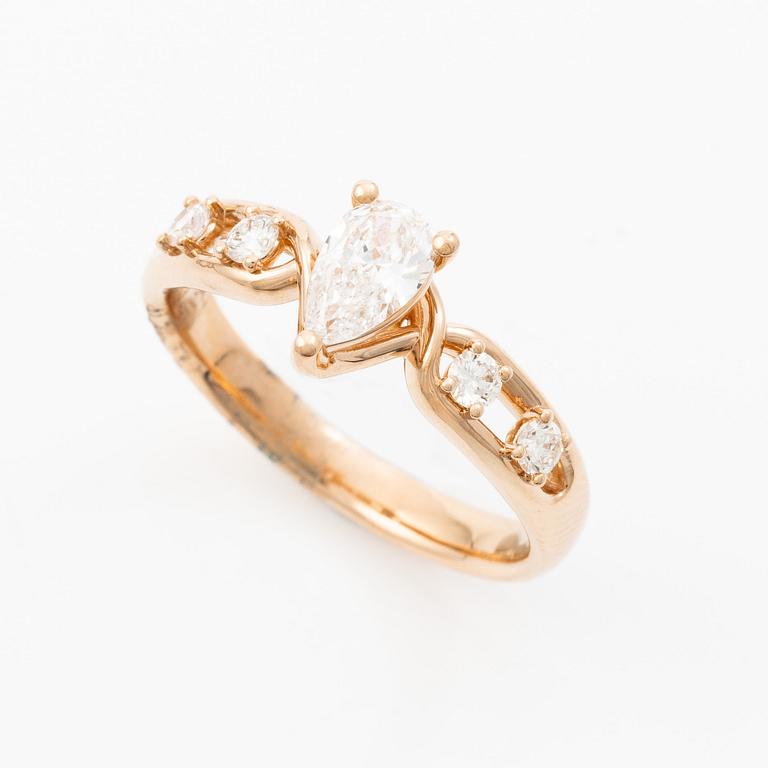 Ring 14K rose gold with a pear-shaped diamond and brilliant-cut diamonds, accompanied by an IGI report.