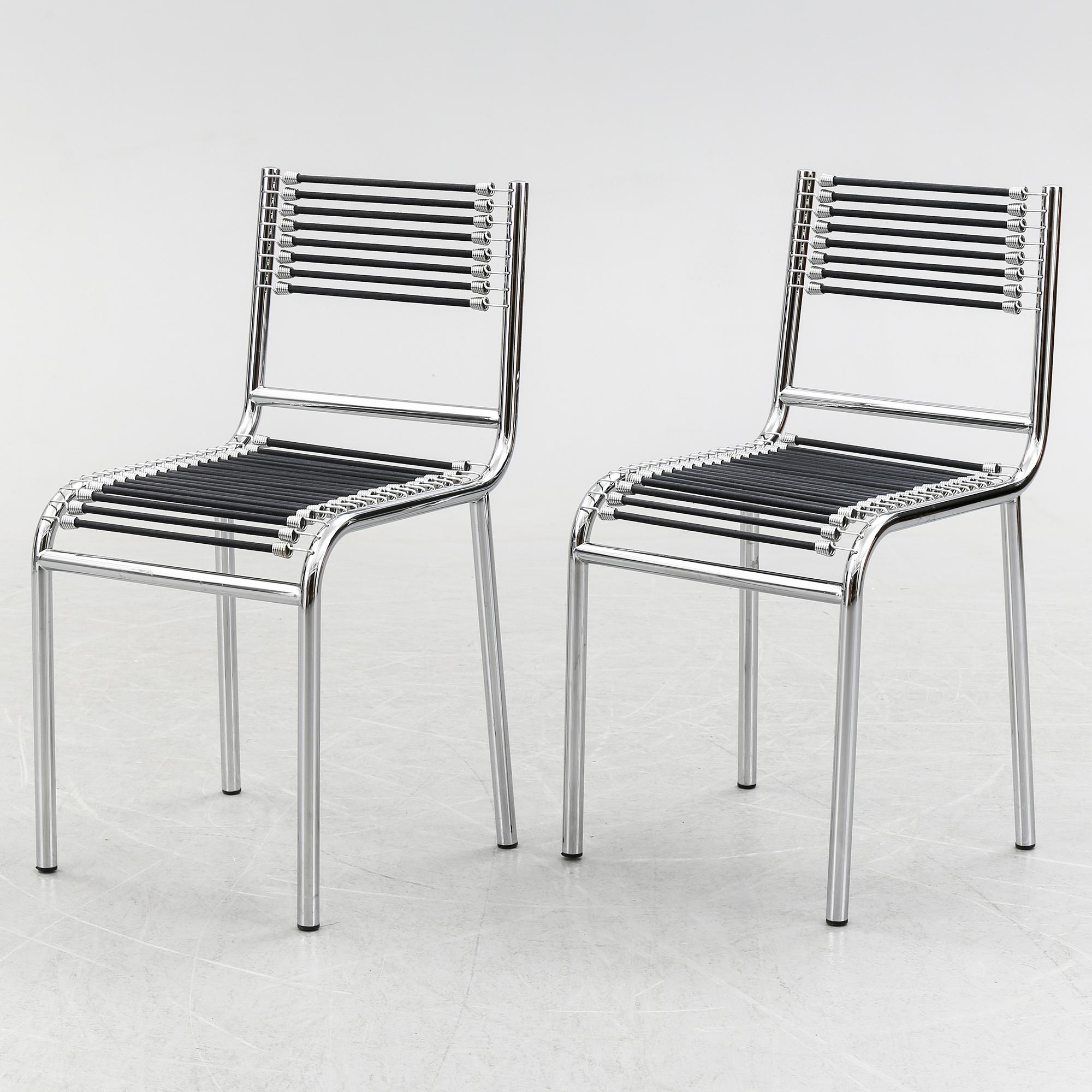 A pair of Rene Herbst chromium-plated, "Sandows" chairs, late 20th century.