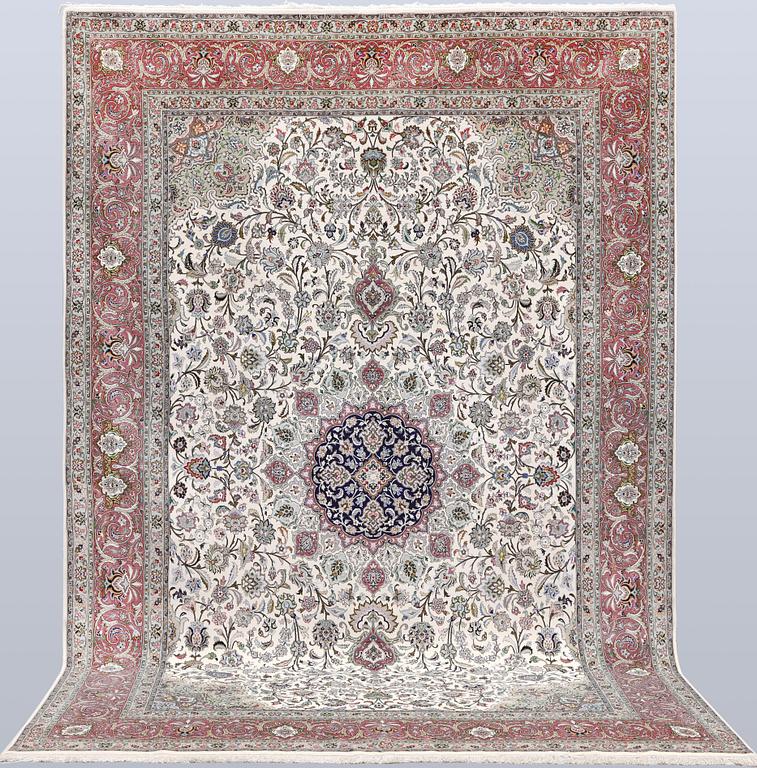 A part silk Tabriz carpet, 310 x 205 cm.