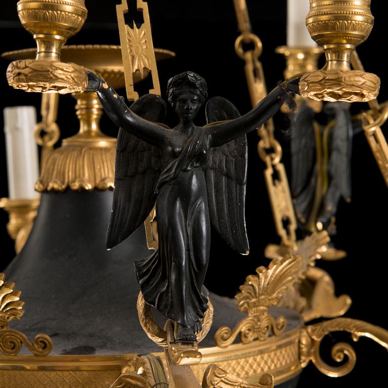 A first half 19th Century empire nine-light hanging lamp.