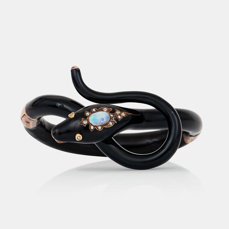 A Victorian snake bracelet in black enamel set with an opal and rose-cut diamonds.