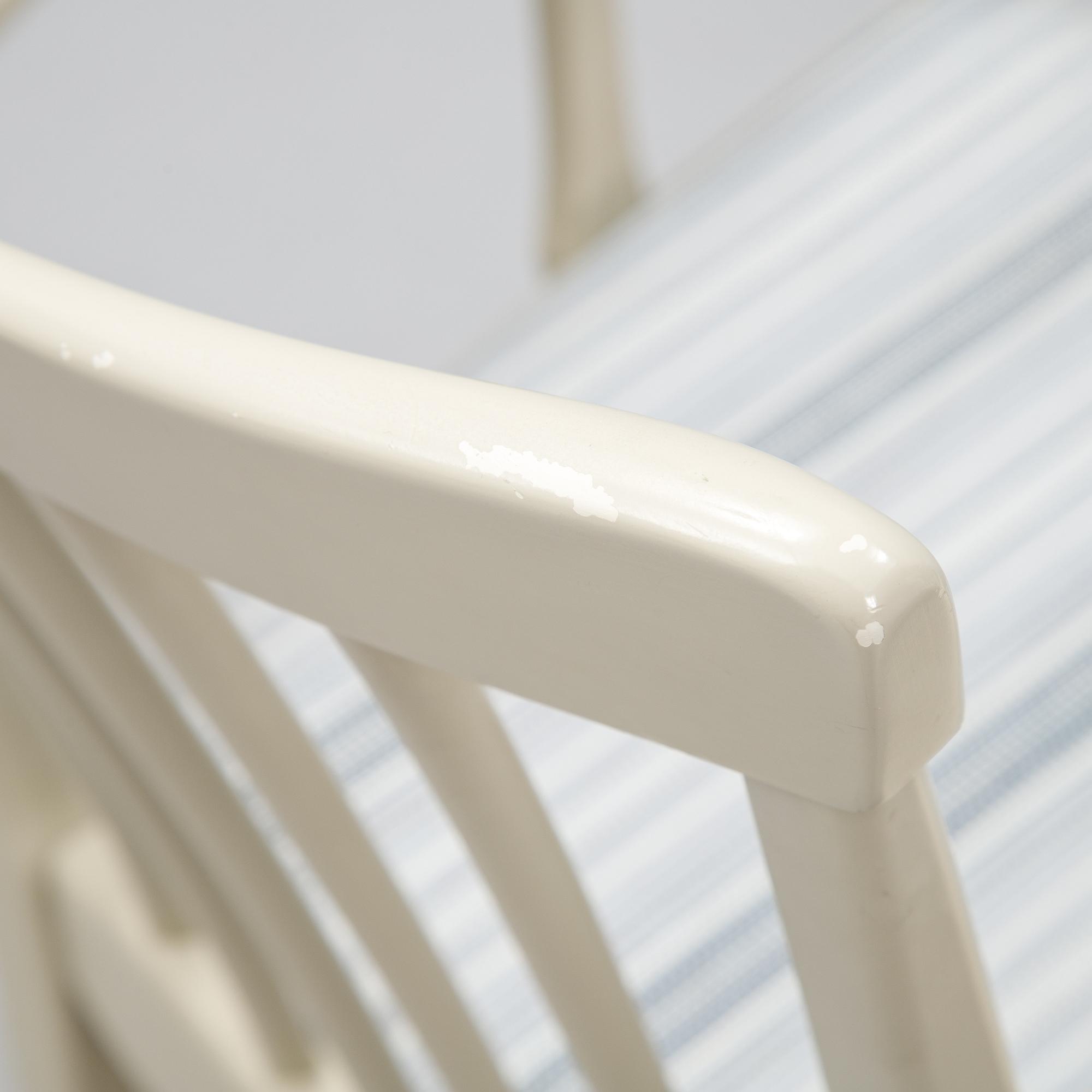 A dining table with two armchairs and six chairs by Carl Malmsten for Bodafors.