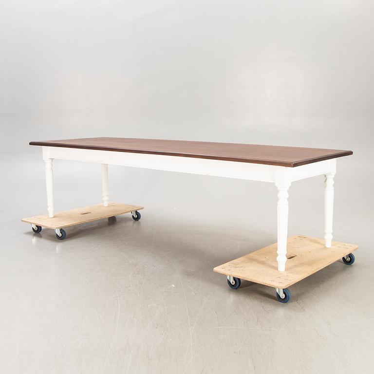 A painted and stained table 21st century.