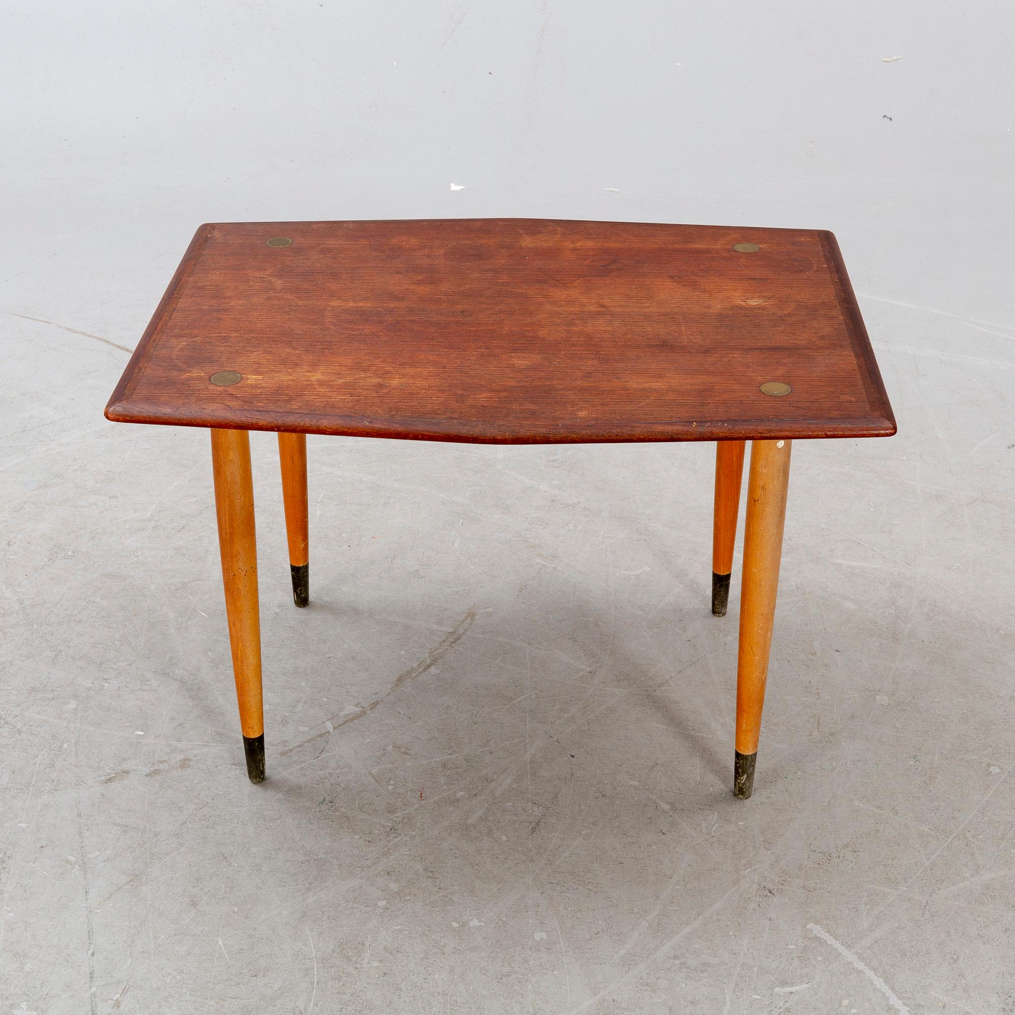 A mid 1900s teak coffee table from Tingströms möbler.