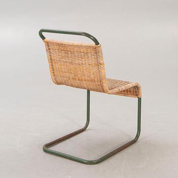 A 1930s braided rattan and metal chair.