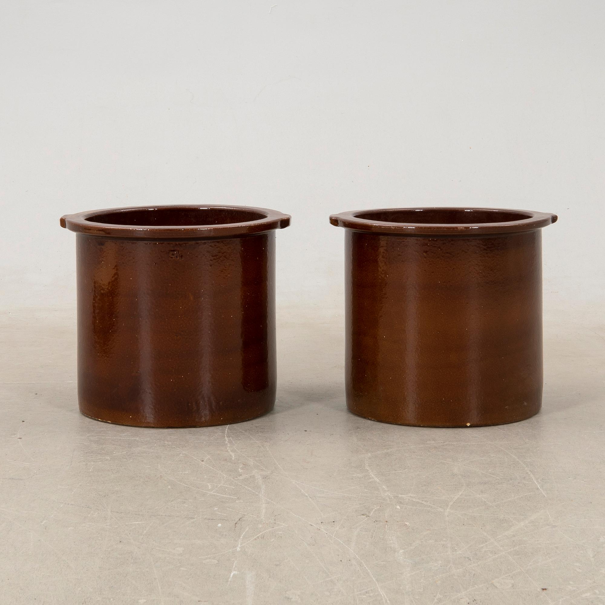 outer casing/vessel a pair of glazed ceramics.