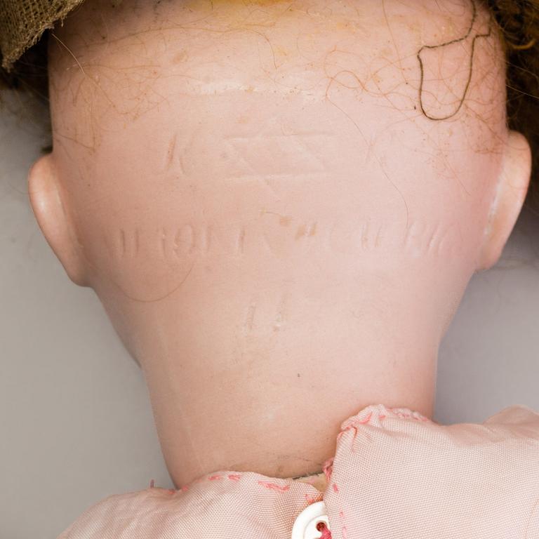 A Simon & Halbig 117n bisque head doll, Germany.