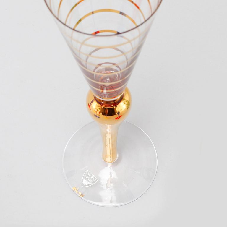 Nine late 20th century champagne glasses and decanter, "Clown", for Orrefors.