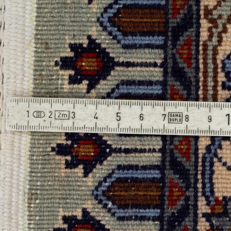 A CARPET, Kashmar, part silk, signed Mosafar Khan, around 344 X 241.